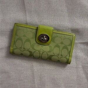 SOLD‼️lime green coach turnlock wallet